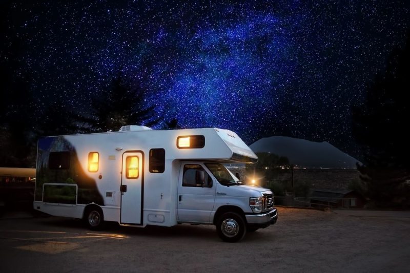 motorhome parked under beautiful night sky